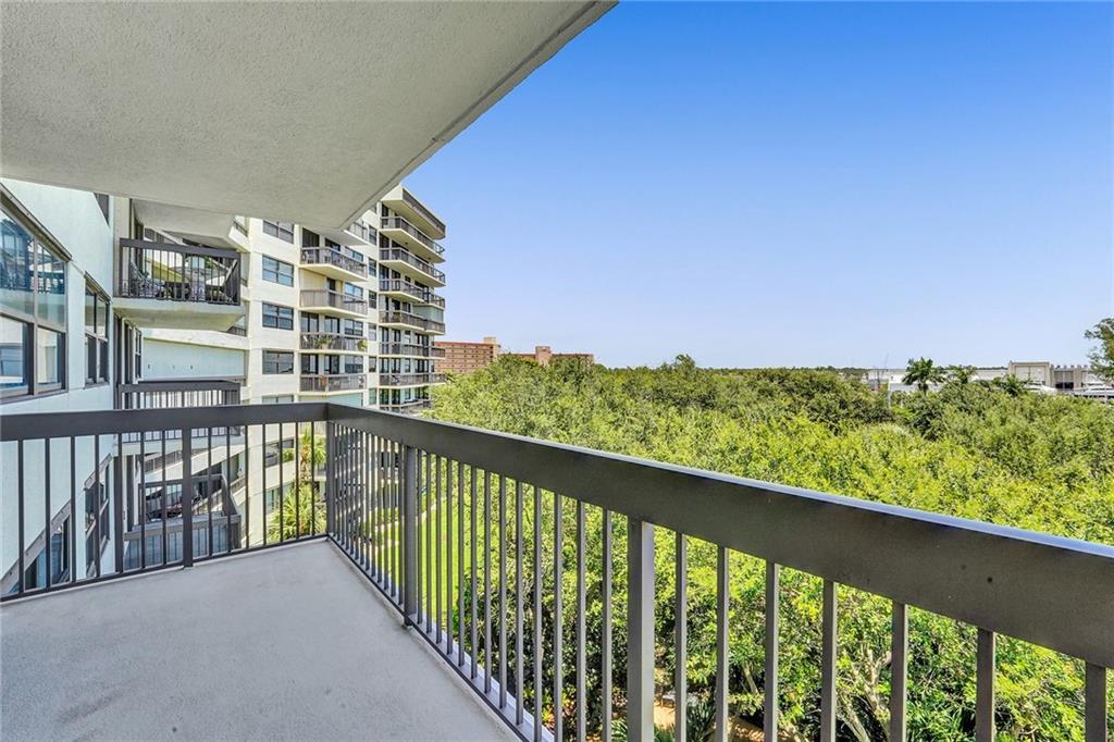 The balcony view facing west, towards the beautiful, tropical, well kept grounds.