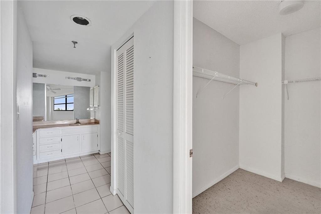 The primary bedroom has two walk in closets and a linen closet. The primary bathroom is just beyond the closets.