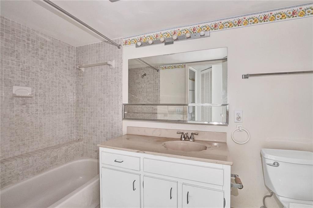 The primary bathroom has a tub and a shower.