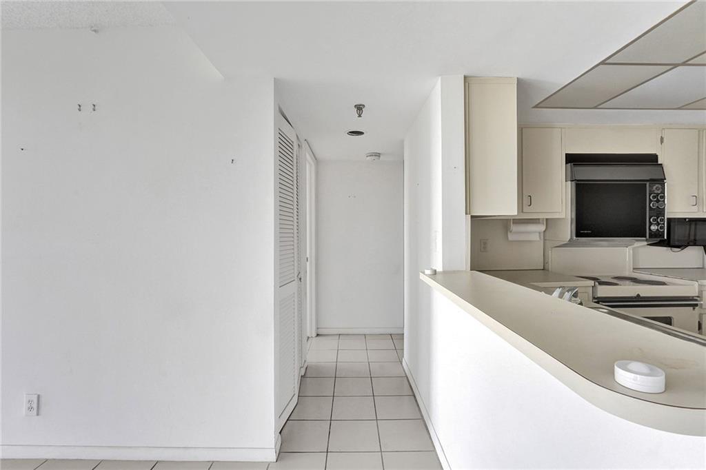 This is a split bedroom floor plan, so the second bedroom is to the right of the kitchen.