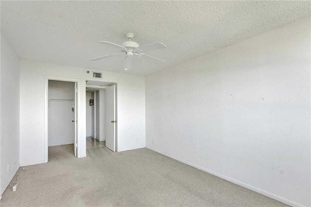 The second bedroom, with your back to the windows and the view. There is a closet on the left, and the other doorway on the right leads to the second bathroom.