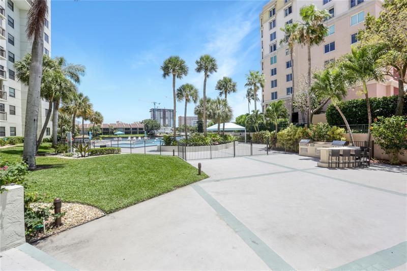 The entrance to the pool area. There is an area to barbeque. There is plenty of seating both in the sun and the shade. The views from this pool area of the intracoastal waterway and the boats constantly going by are absolutely spectacular.