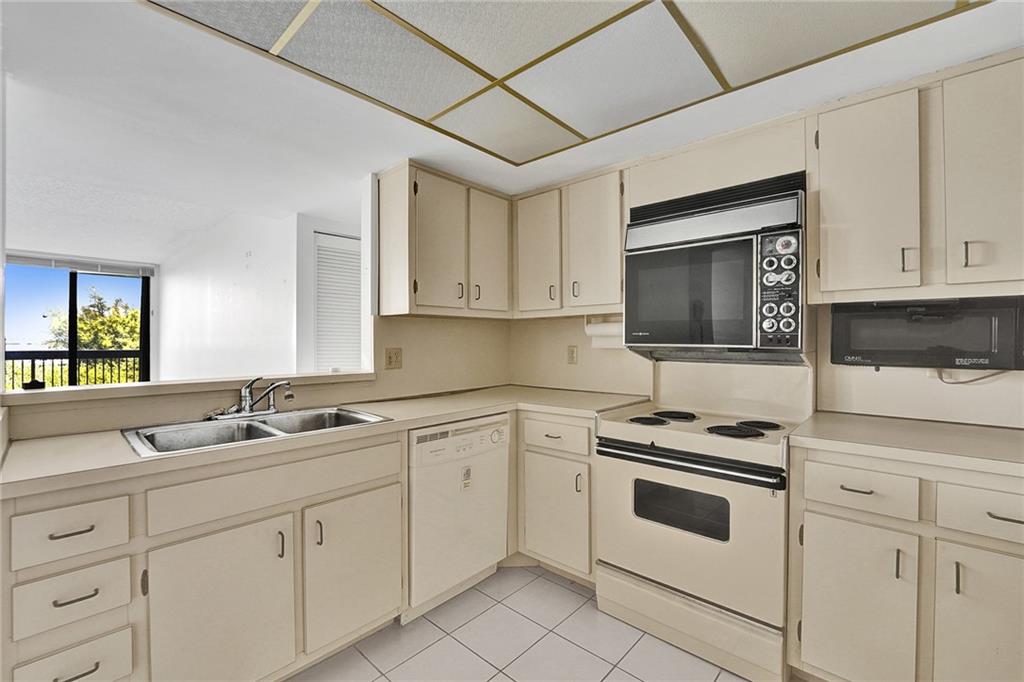 The open peek thru allows you to see into the living room and out to the balcony.