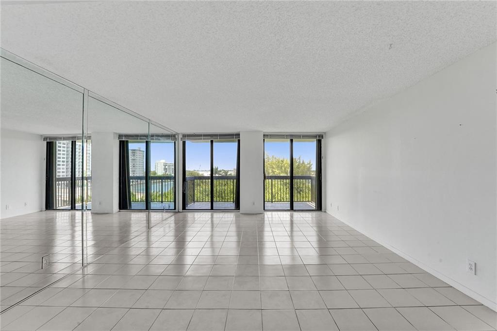  The living room has two sliding doors that go out to the balcony.