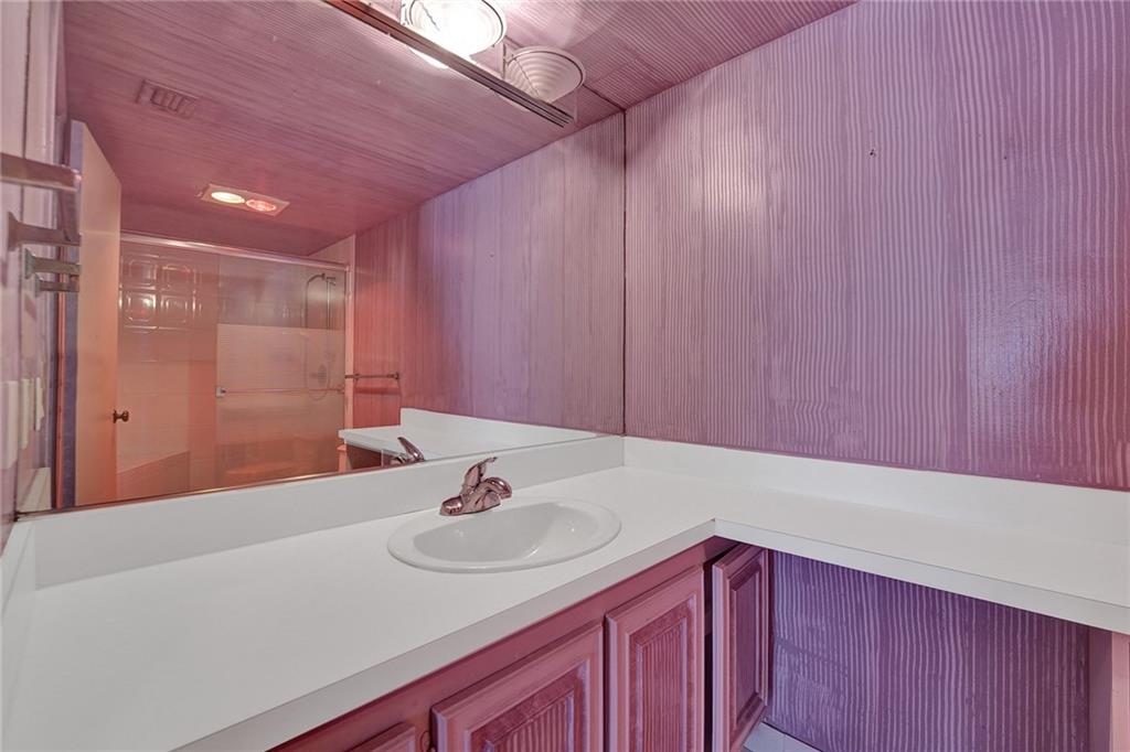  The guest bathroom has a full tub and shower.