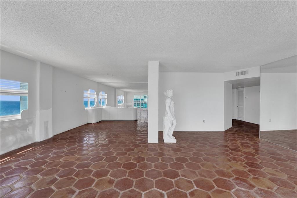 The previous owner loved to cruise, so he temporarily altered the shape around the windows, using plywood, which is easily removed, to mimic cruise ship cabin windows.