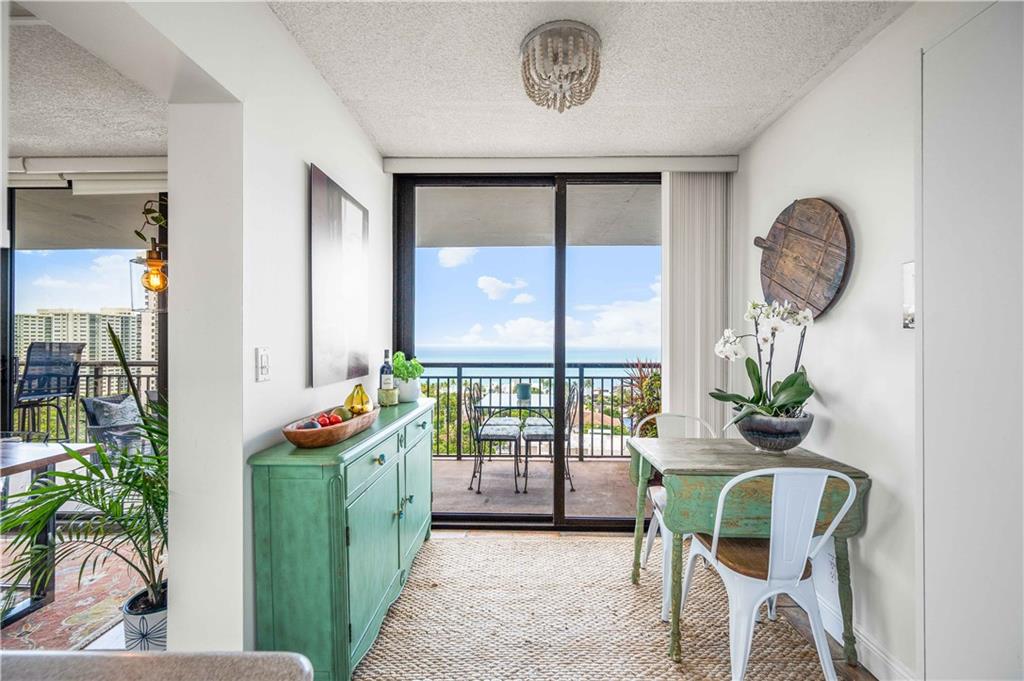 Quaint breakfast nook overlooking the ocean.  **Beaded flush mount fixture does not convey.**
