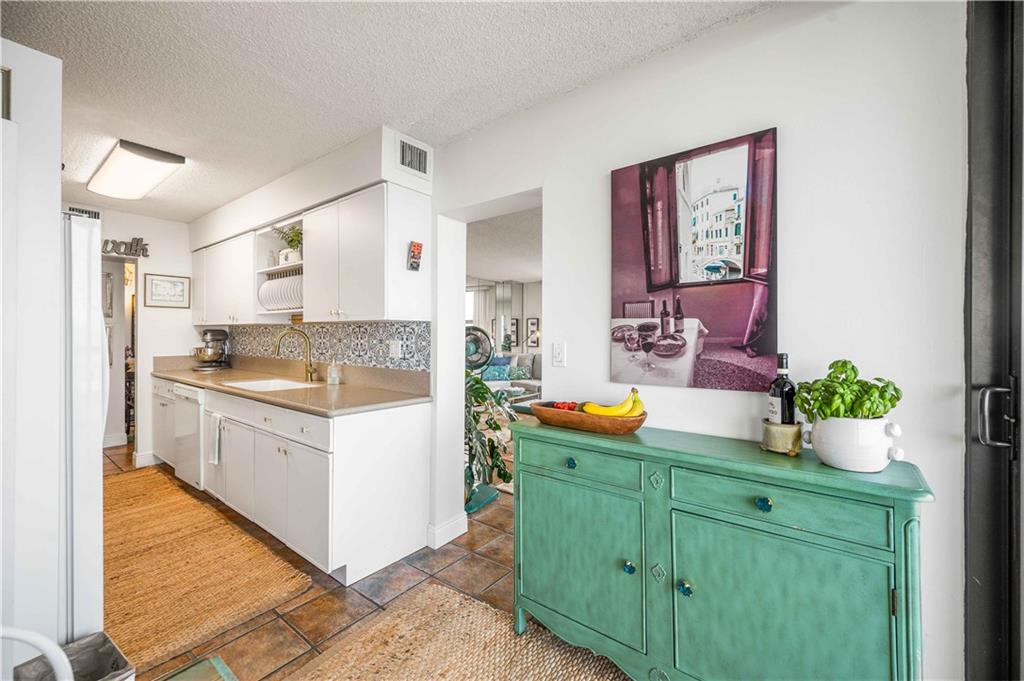 Breakfast nook has access the living room and the balcony.
