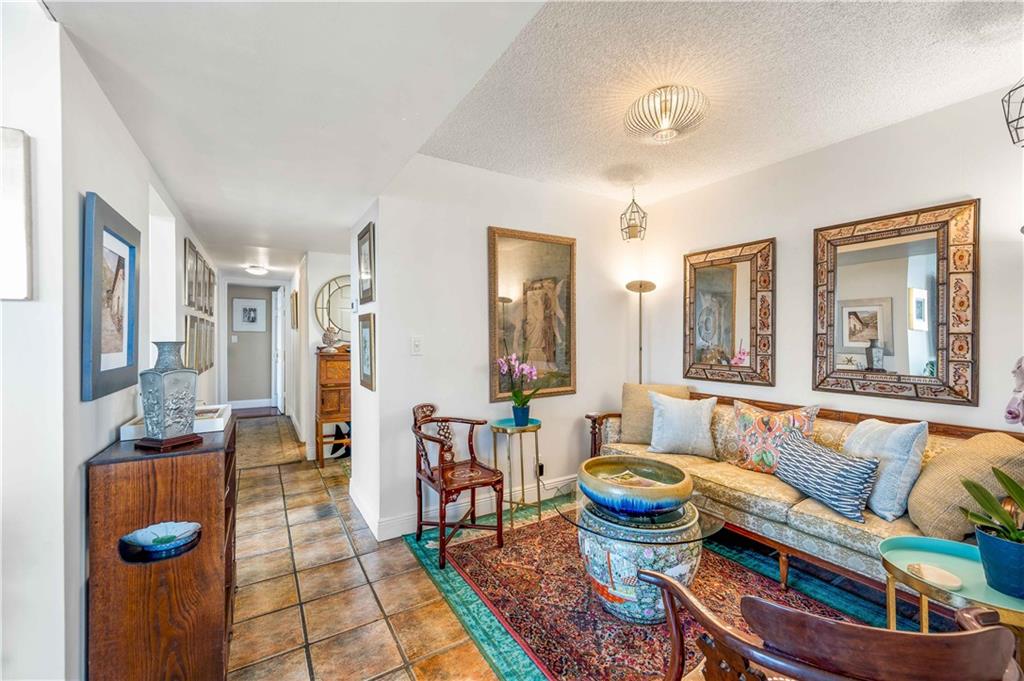 The formal dining room is adjacent to the living room and kitchen, though current tenant set it up as a cozy sitting room.