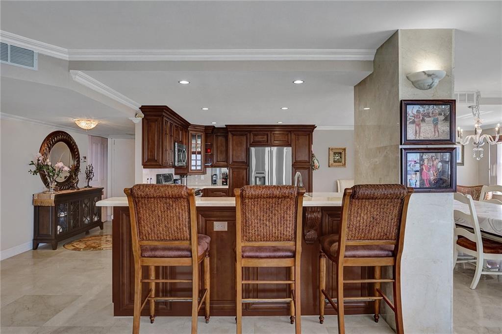 The door to the right of the bureau and the mirror is a closet. The front entry way double doors are after that.