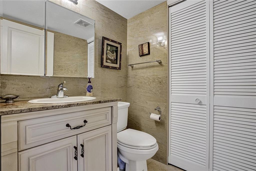 The half bathroom houses the washer and dryer.