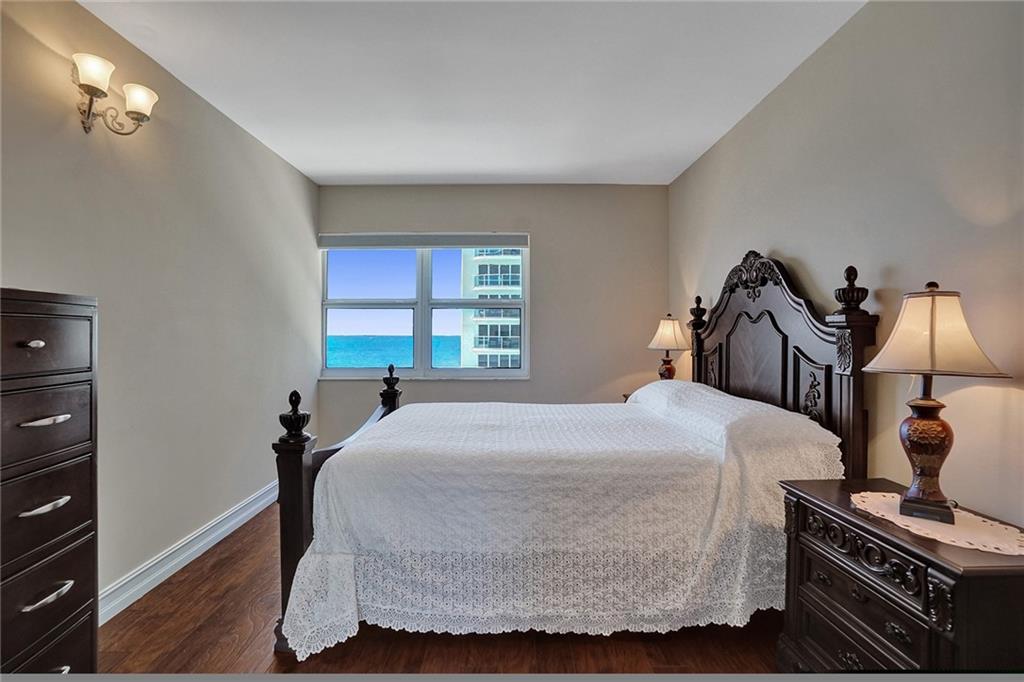 The second/guest bedroom, where the bed has been perfectly situated to take advantage of the ocean views.