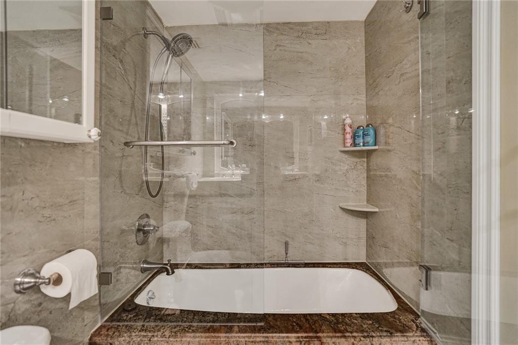 The second bathroom has a large tub; perfect for soaking after a long day on the beach.