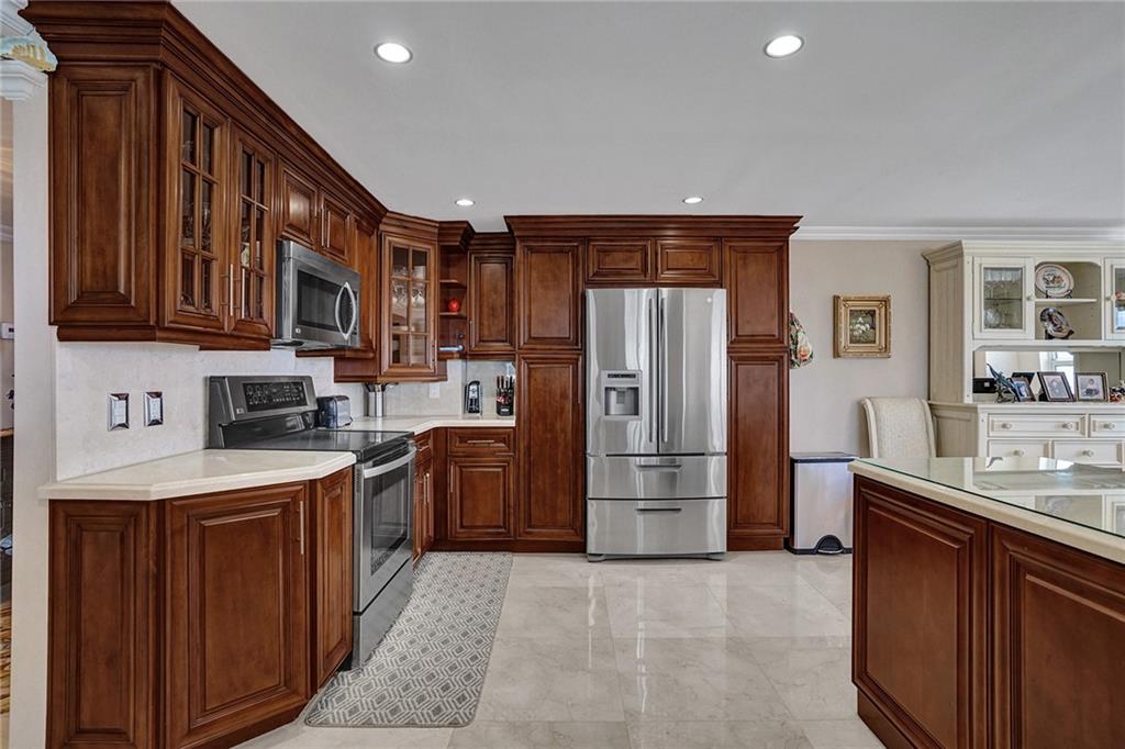 The kitchen has stainless appliances and plenty of cabinet space.