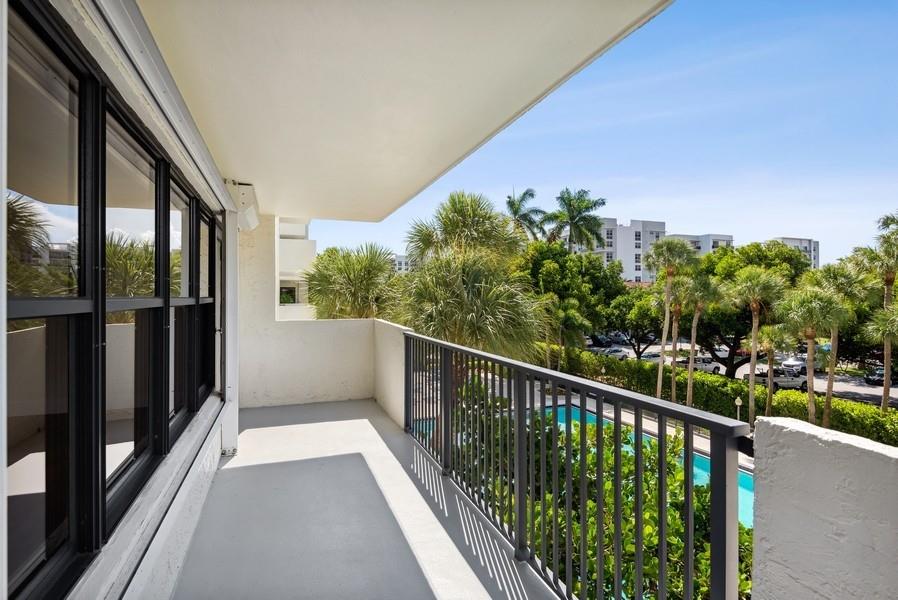 Front of wrap around balcony w/pool view.