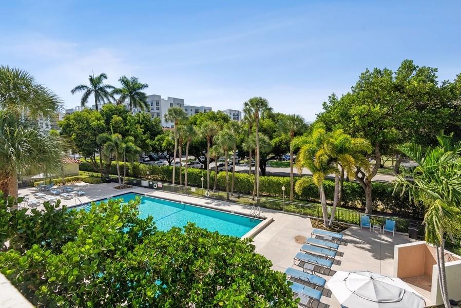 Front of wrap around balcony, South exposure over looking pool.