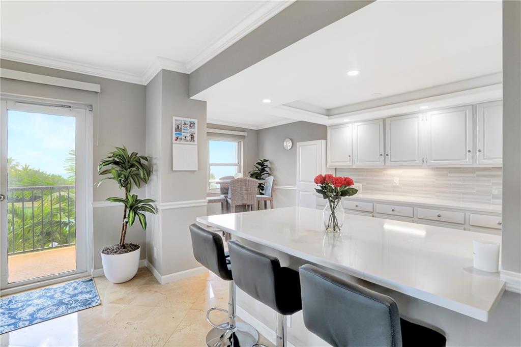 Opened kitchen with quartz counter tops.