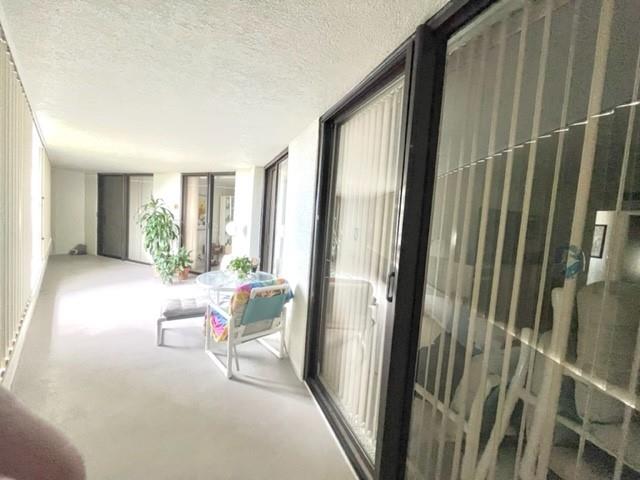 38' covered sought after pie shape balcony protected with accordion shutters