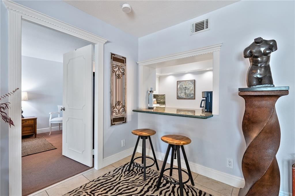 bar area looking into kitchen