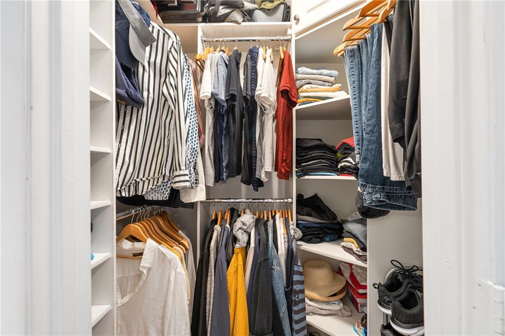 Primary bedroom walk-in closet