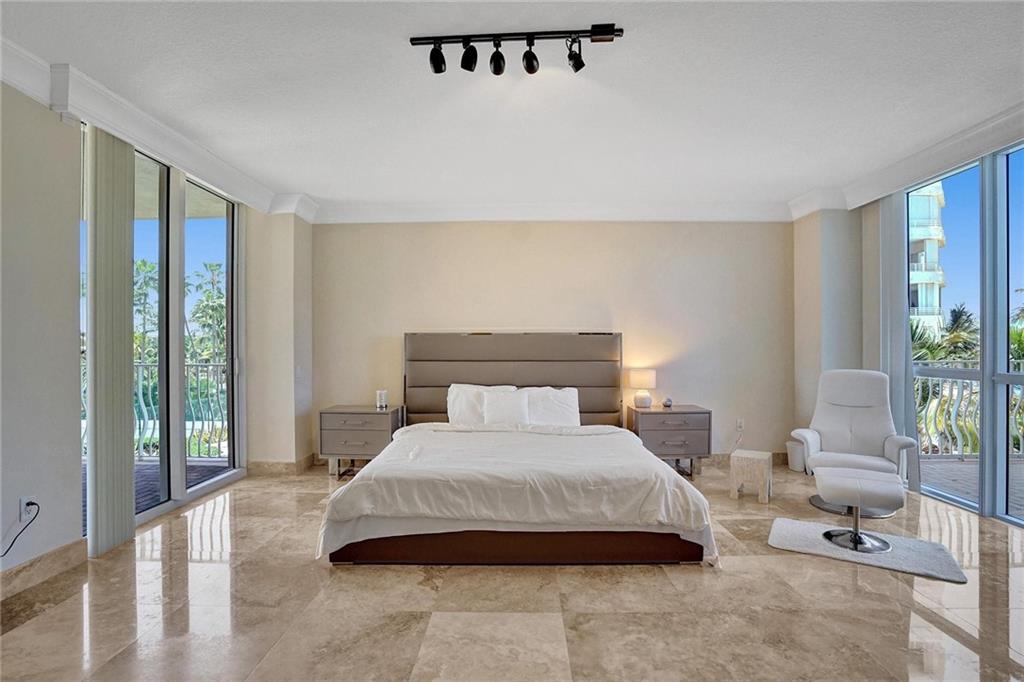 2nd bedroom with front and back balconies.