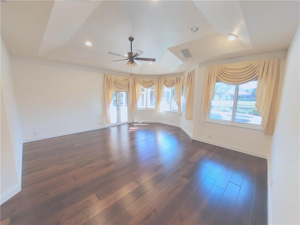 Owners bedroom opens up to heated pool & waterfall spa