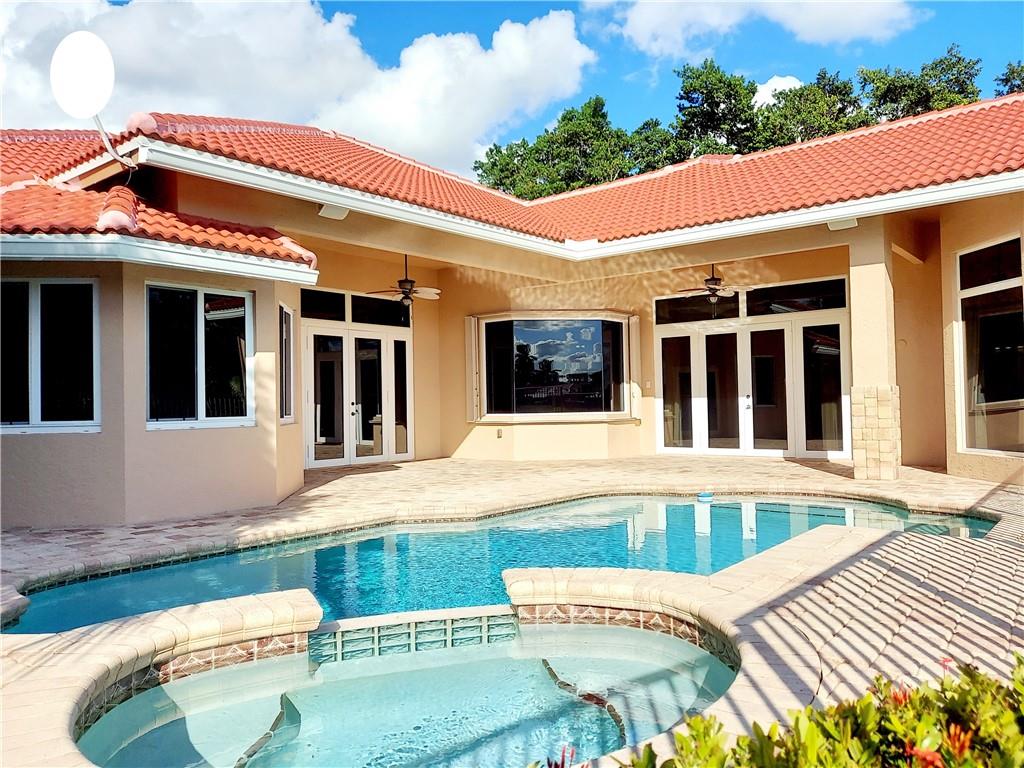 Back view of home.  New 2022 Roof & gutters