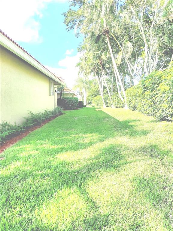 Private landscaping surrounds this home