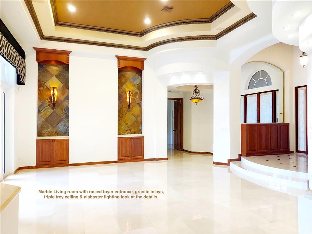 Living room marble floors triple tray ceilings