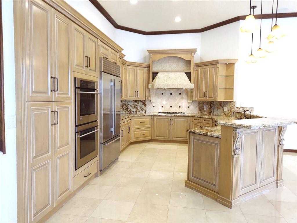 Open kitchen dual oven, Sub-zero refrigerator, Miele dishwasher, Viking 6 burner gas cook top.