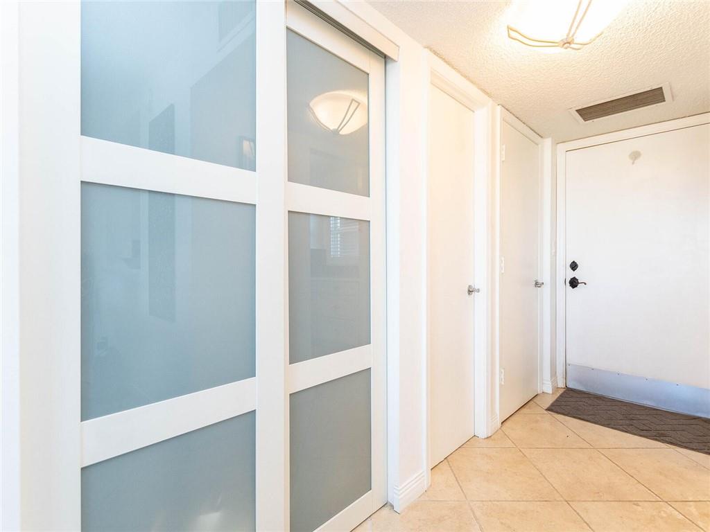 Foyer entrance with powder room.