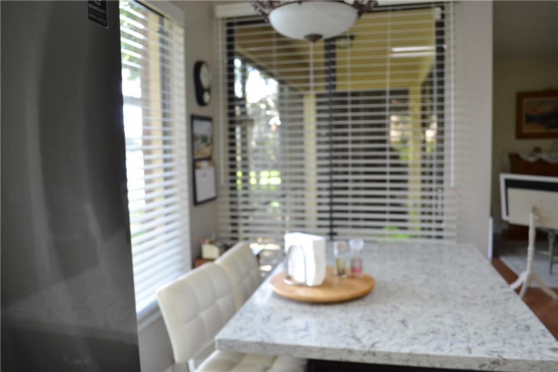 ENTRY TO THE SCREENED PORCH FROM KITCHEN AND NOTICE THE LAKEVIEW WINDOW.