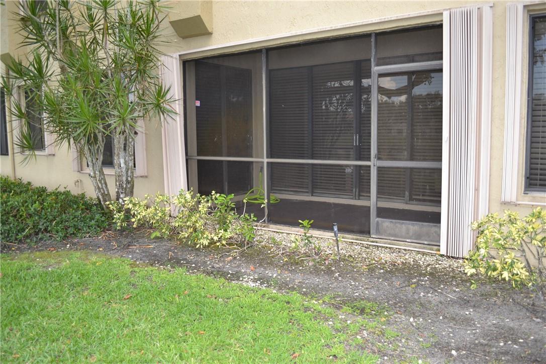 THAT'S YOUR SCREENED PATIO COMPLETE WITH ACCORDIAN SHUTTERS.