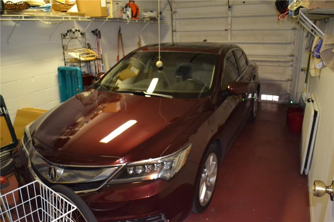 OVERSIZED GARAGE WITH ELECTRIC GARAGE DOOR OPENER.