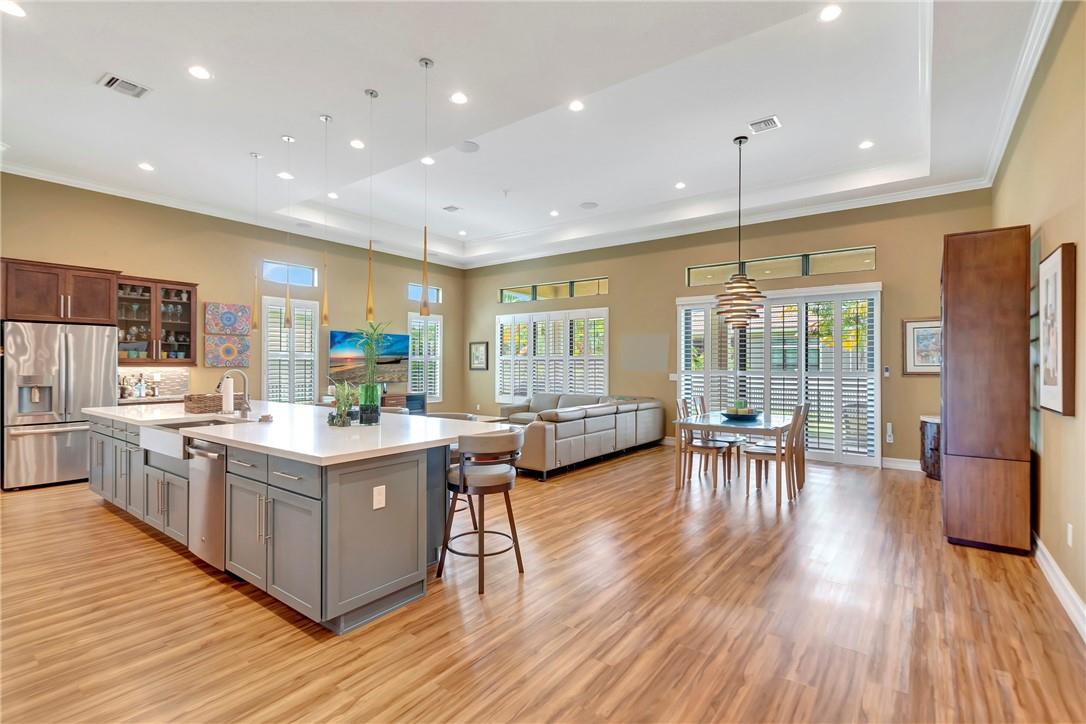 This newly construction home has been meticulously crafted with an abundance of upgrades including: luxury vinyl flooring, high impact windows/doors, white plantation shutters, 13 ft tray ceilings, LED recessed lighting and so much more! No detail has been overlooked when building this home (a full the list of upgrades available upon request).