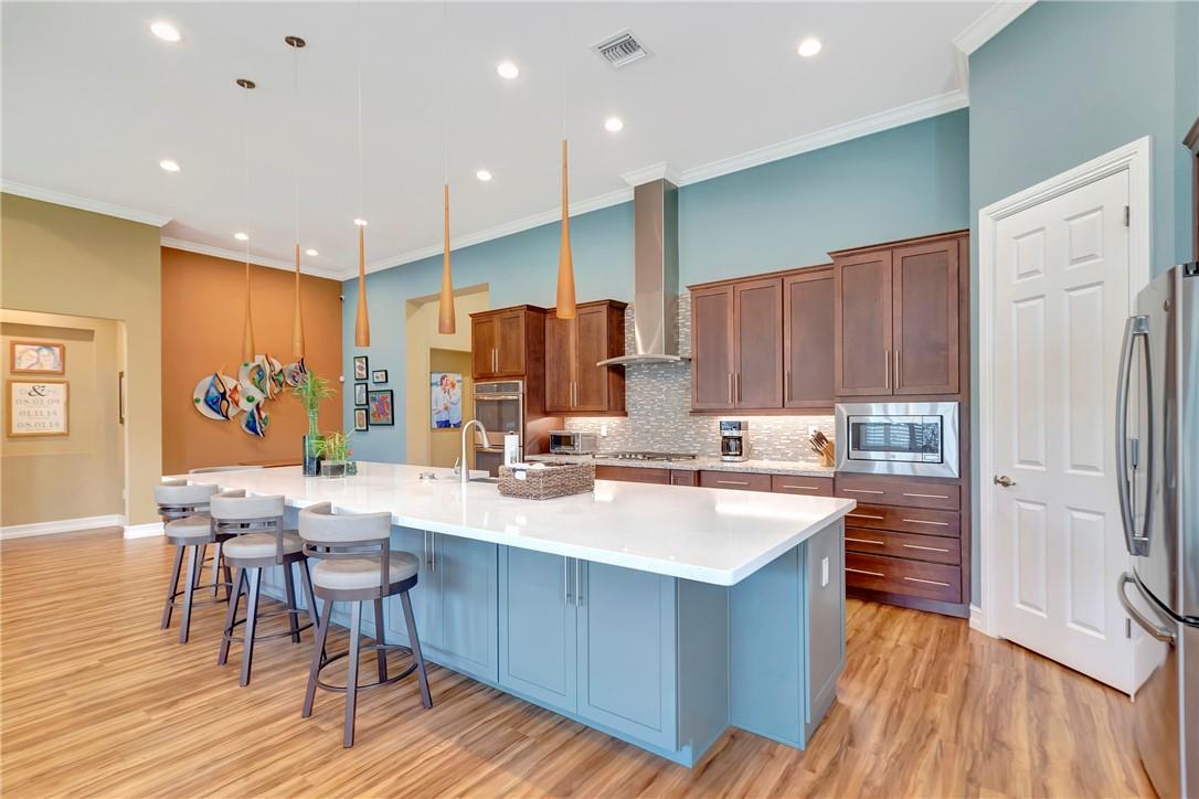 The Kitchen was upgraded to include custom cabinets on the front side of island providing an abundance of additional storage.