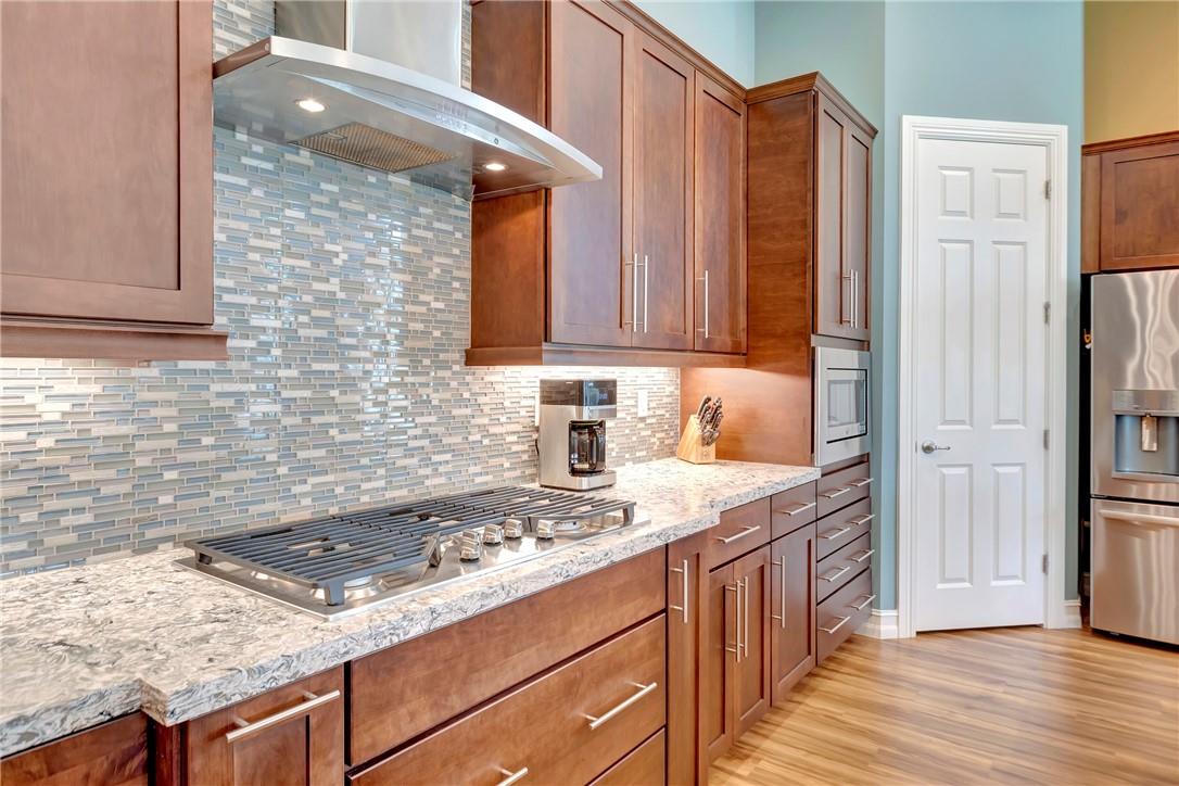 The Kitchen was upgraded to include custom built in drawers below stove for pots and pans.