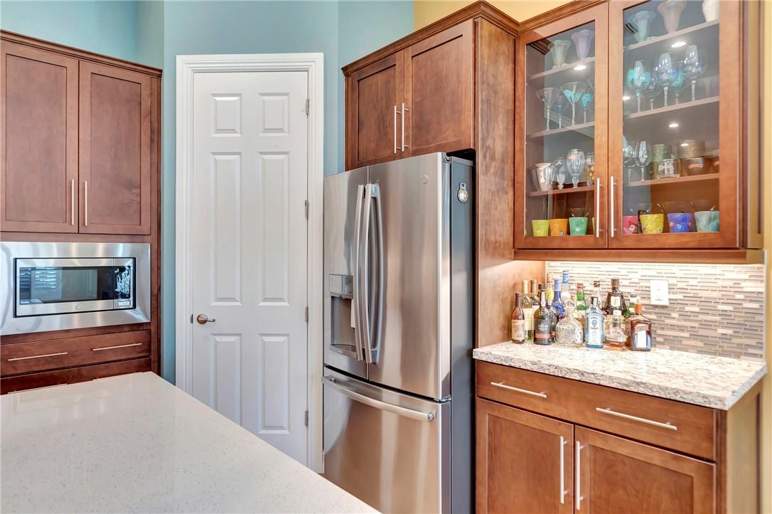 The Kitchen has full pantry with customized shelves.