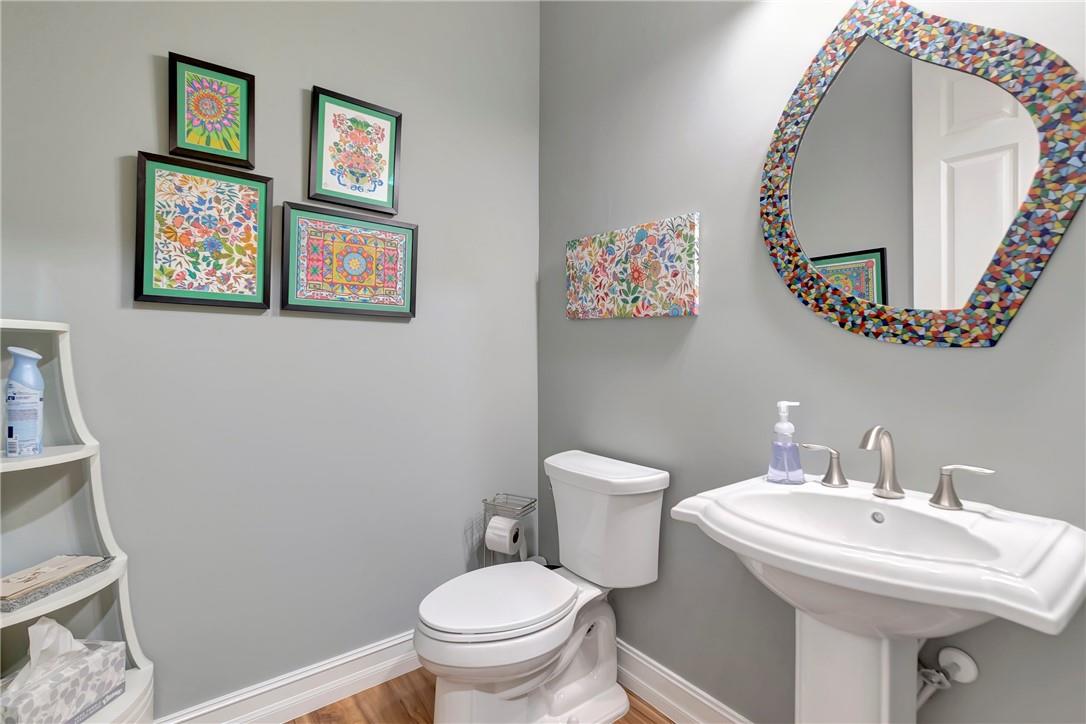 Half bathroom located near the office/den.