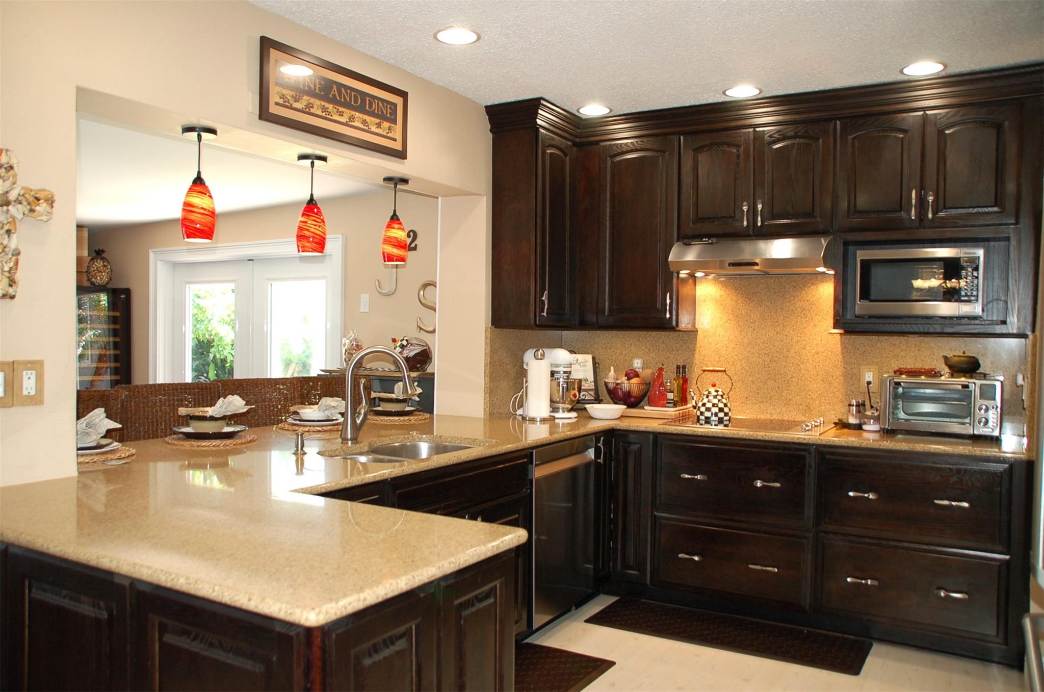 Kitchen is open to family room with breakfast bar
