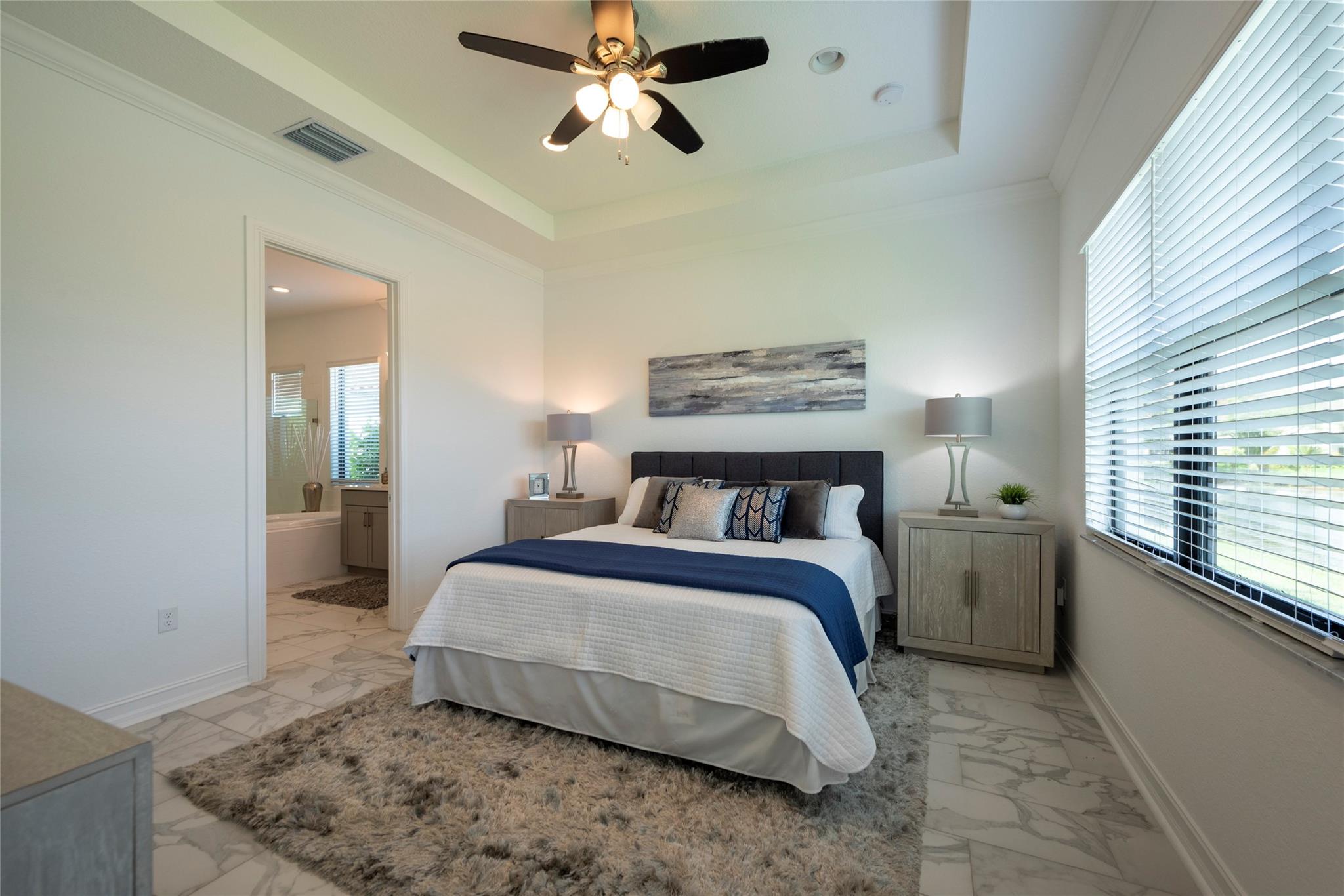 HUGE PRIMARY BEDROOM ON THE FIRST FLOOR, FRESHLY PAINTED AND HAS A GORGEOUS LAKE VIEW! WHAT A WAY TO BEGIN EACH AND EVERY DAY IN YOUR NEW HOME!!!