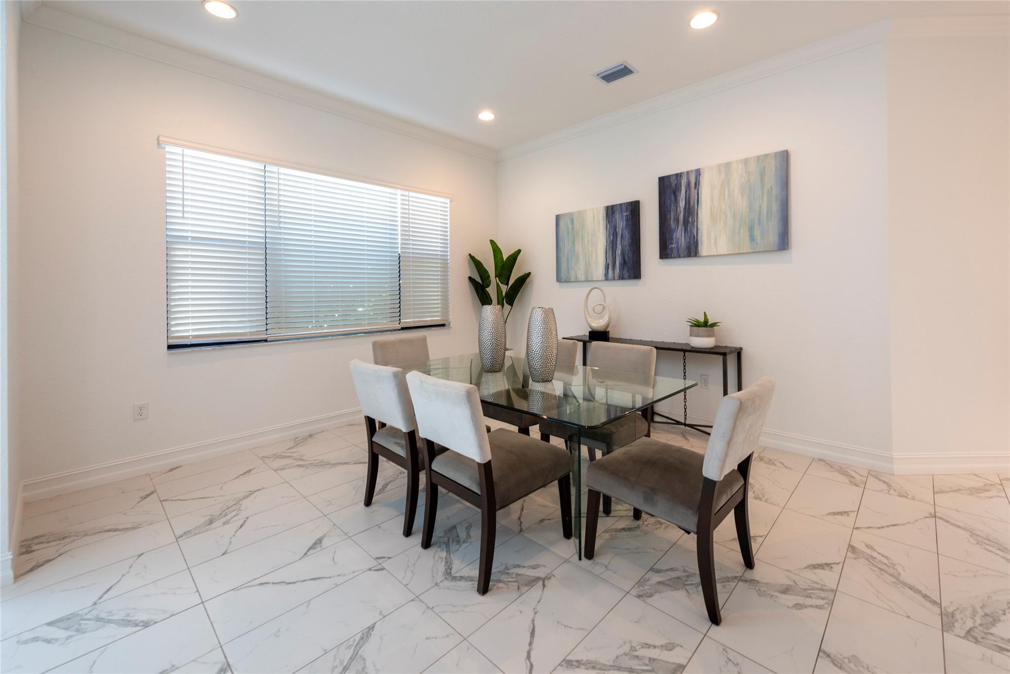 YOUR SPACIOUS DINING ROOM IS BRIGHT AND A PERFECT OPEN ENTERTAINING AREA FOR YOUR ENTIRE FAMILY