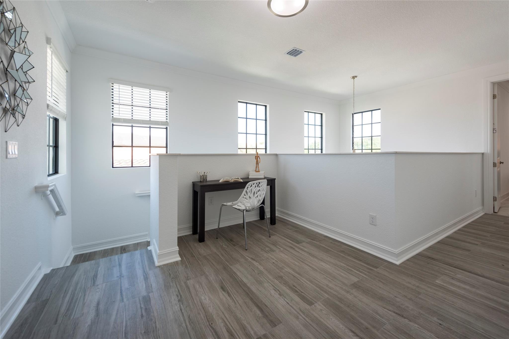 A PERFECT LOFT AREA FOR READING, HOMEWORK OR USING A COMPUTER. FRESHLY PAINTED, NEW WOOD- LOOK TILE FLOORS!  A WONDERFUL SPACE WHICH IS LIGHT AND BRIGHT FROM SECOND STORY WINDOWS