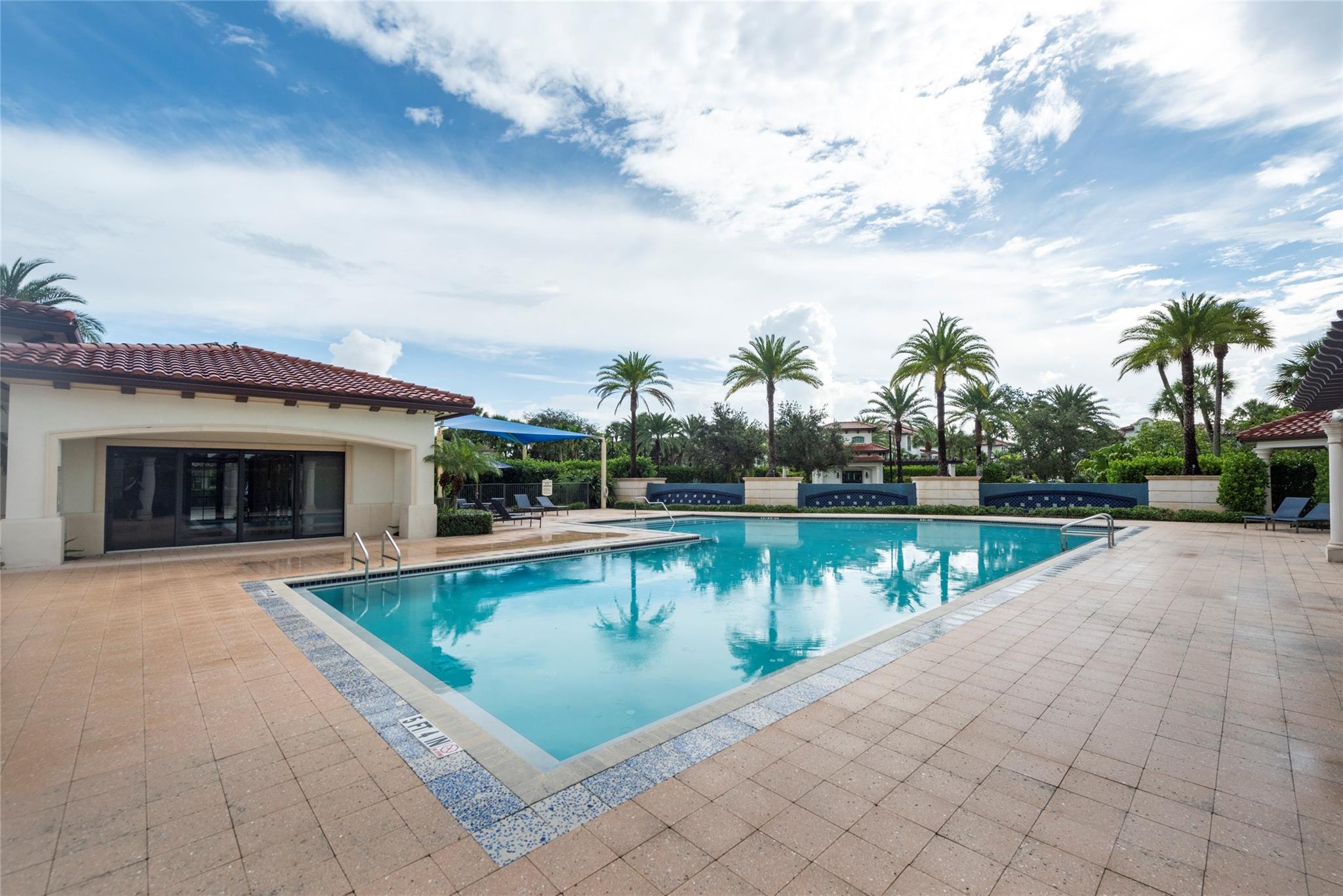 THIS COMMUNITY POOL HAS A HUGE DECK WITH PLENTY OF SPACE FOR YOUR FAMILY TO SPEND A GORGEOUS DAY OUTSIDE