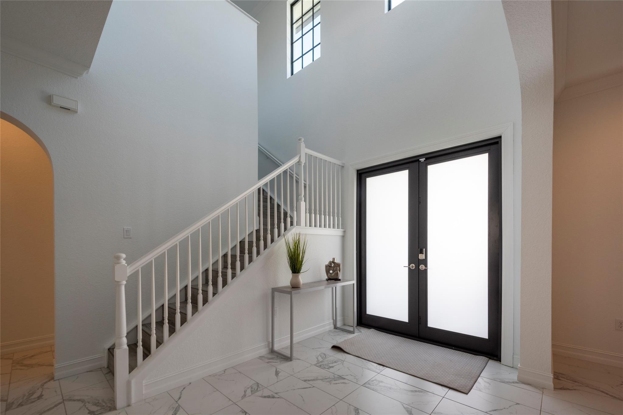 LARGE SPACIOUS ENTRANCE WITH SOARING CEILINGS OPEN 2 STORIES AS YOU ENTER YOUR NEW HOME!