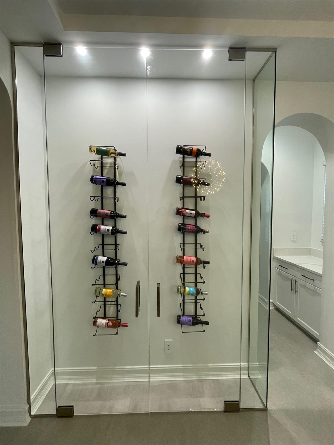 48 BOTTLE CAPACITY GLASS WINE ROOM.
