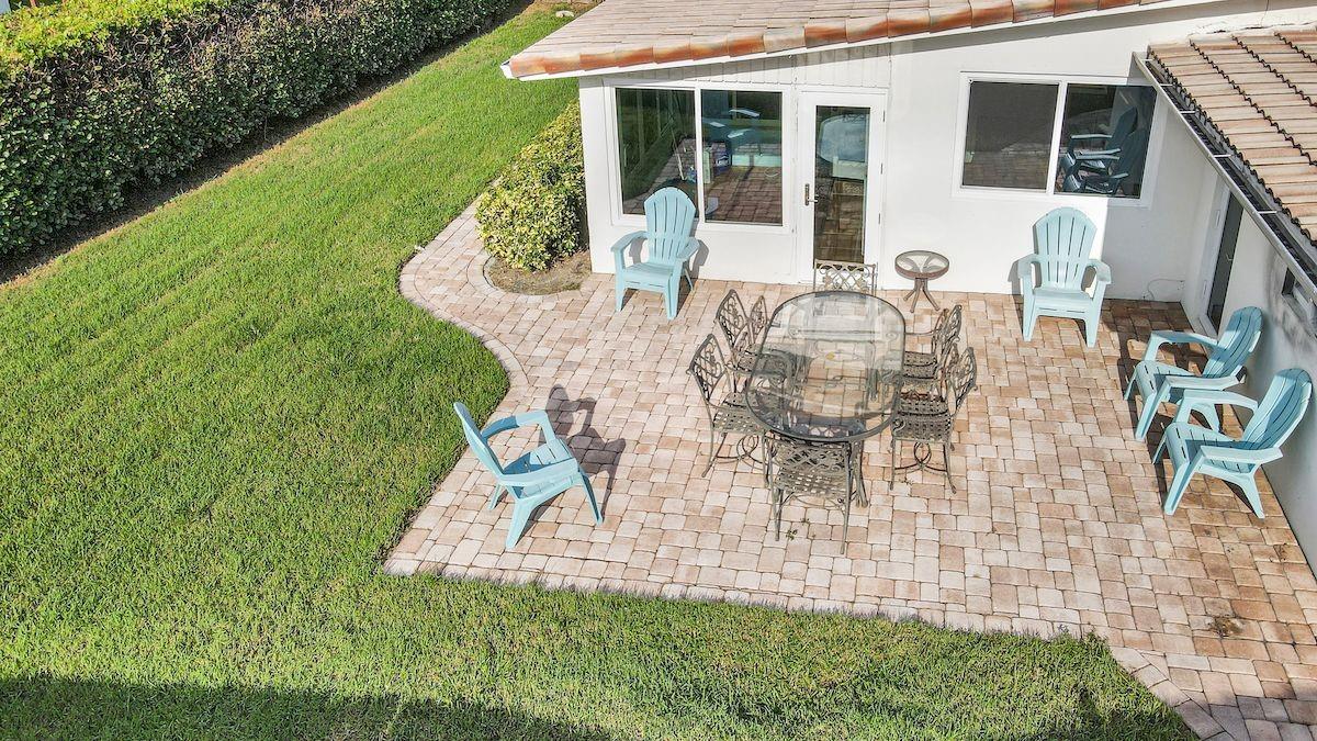 Back yard paved patio. 3 doors to access the back yard