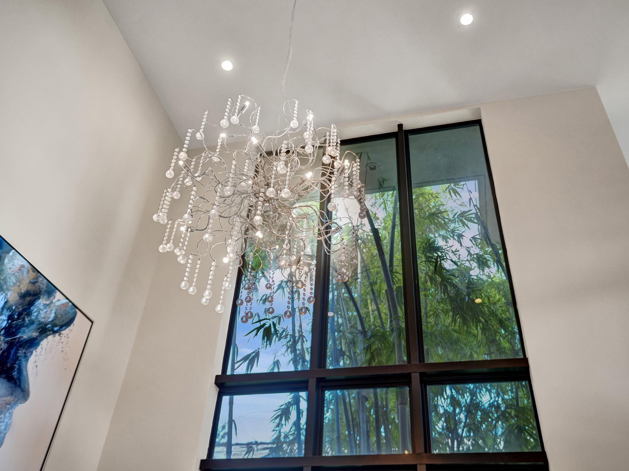Dramatic Fixtures shine in oversized glass windows!