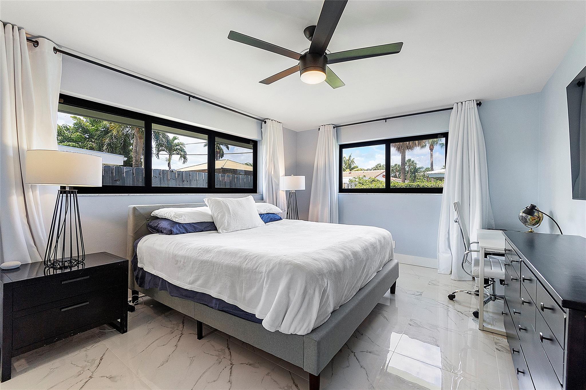 Master bedroom with King Sized bed and other furniture.