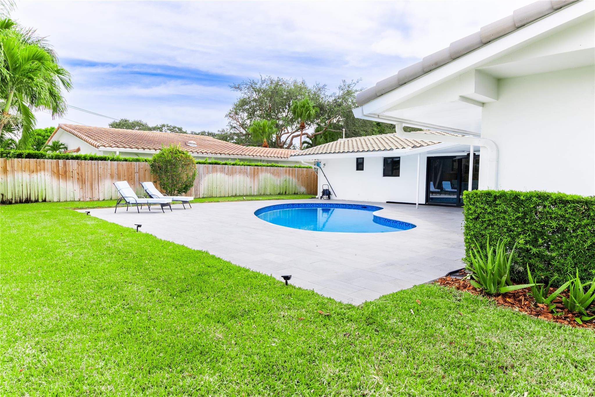 Beautiful pool with saltwater system and heat pump.